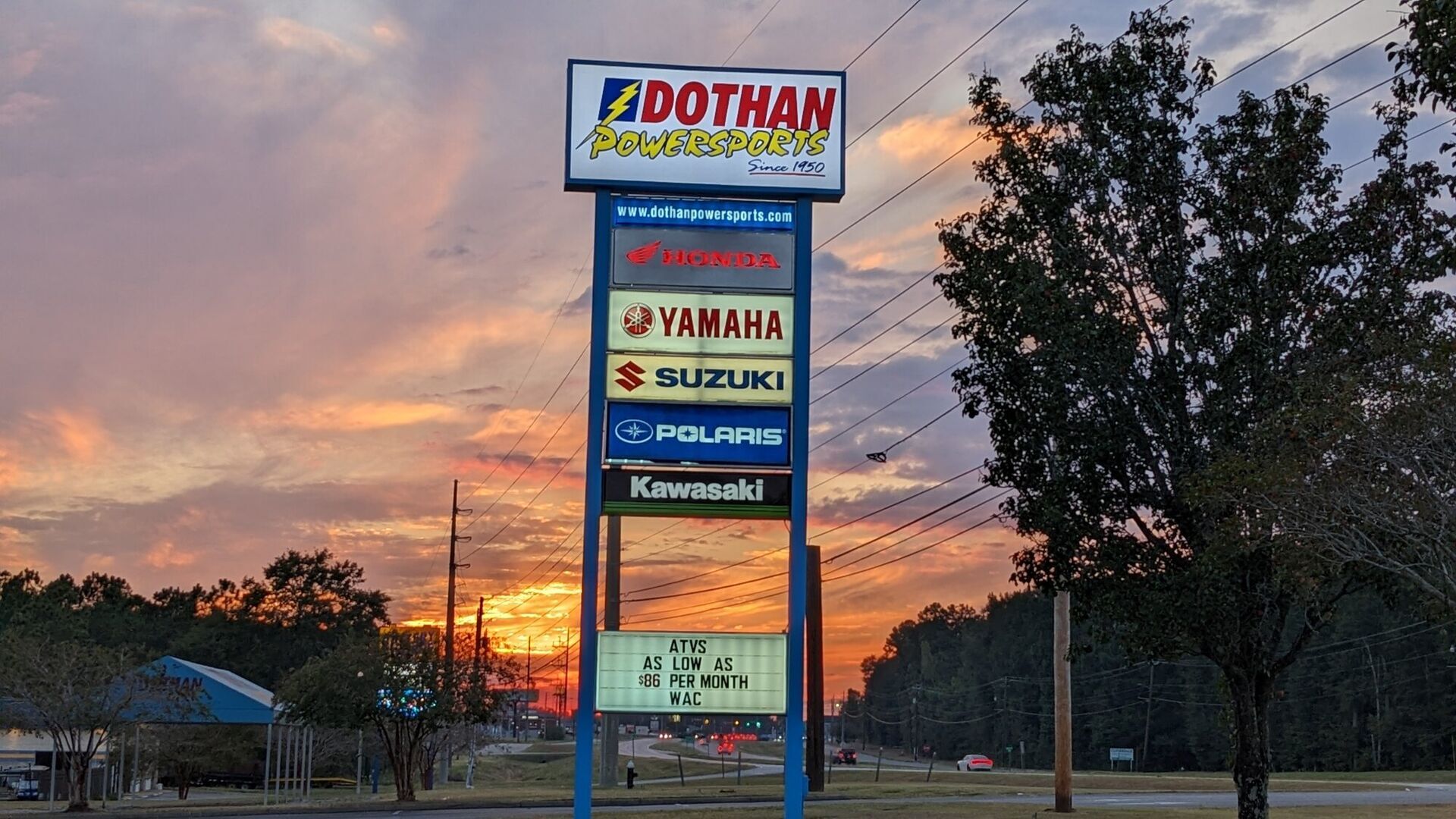 The Dothan Powersports sign at sunset